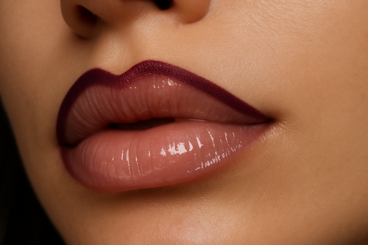 Dark plum lip liner on lips with clear lips